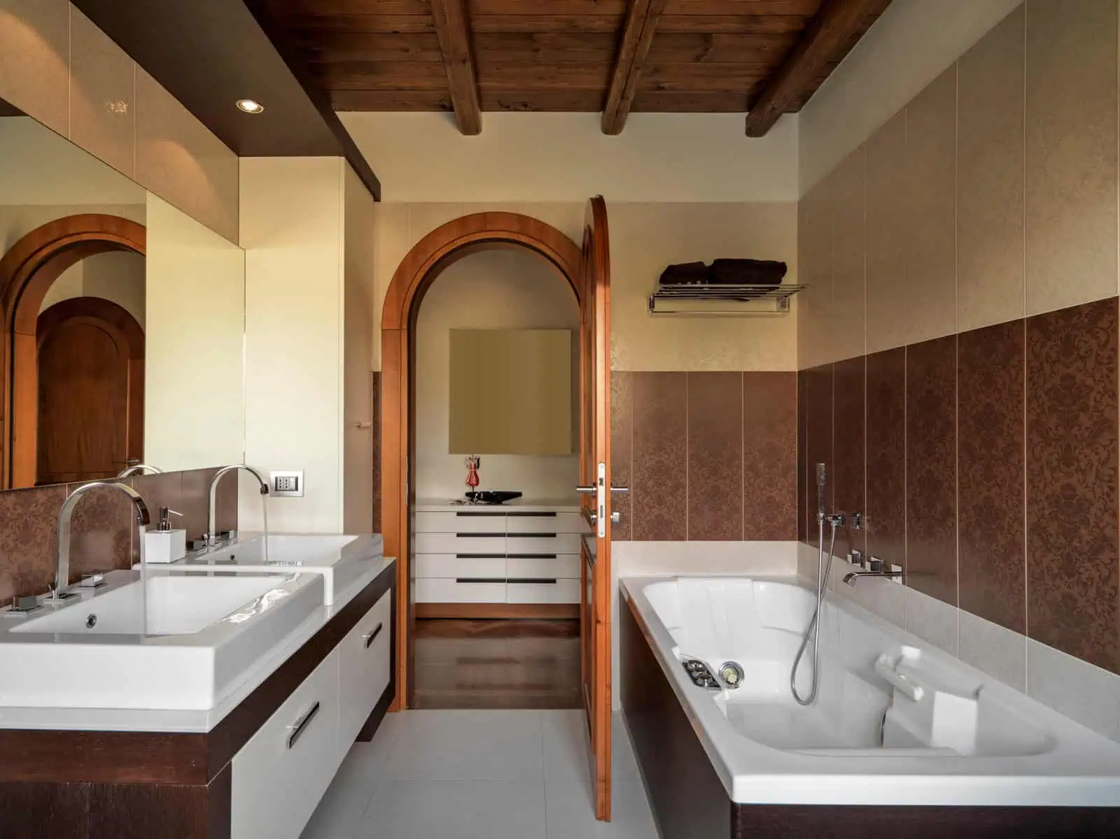 Modern bathroom with double sinks and bathtub in new home.